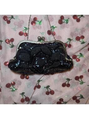 Black beaded purse with silver frame and chain strap